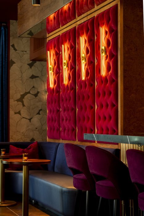 Velvet seating and warm light